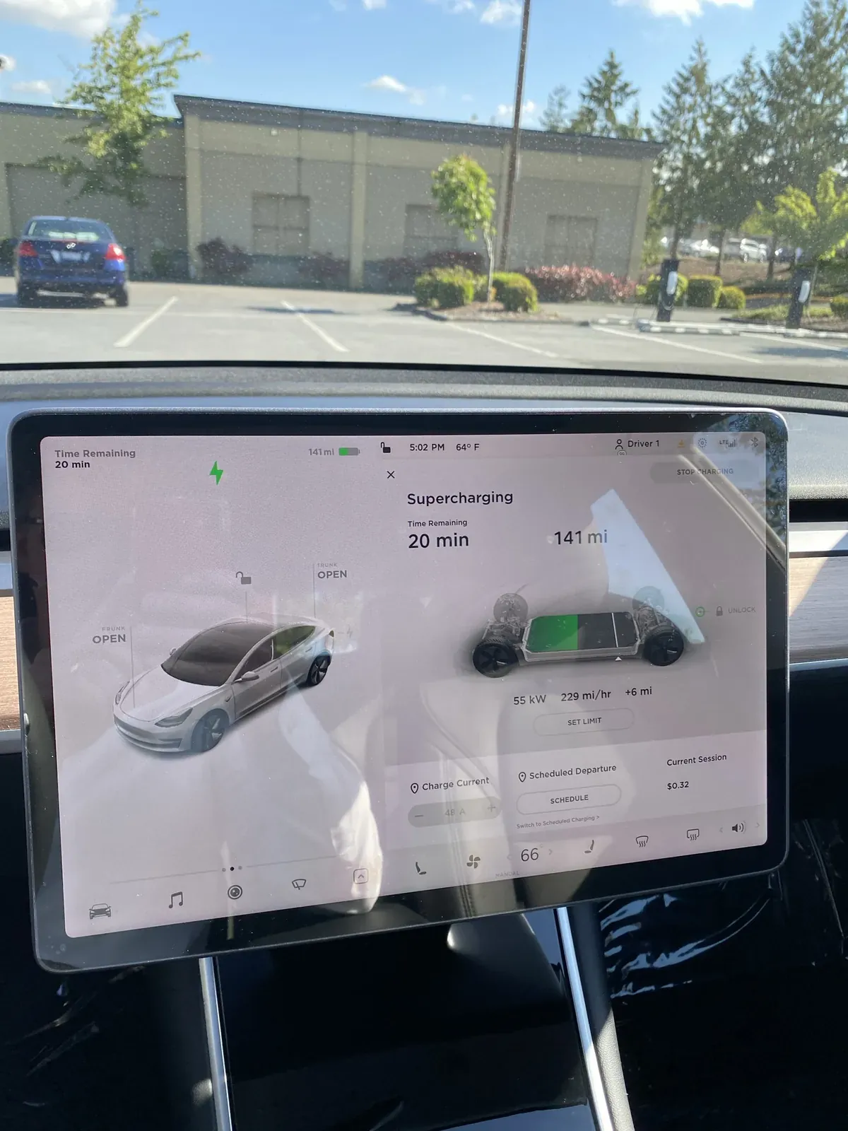 Model 3 touchscreen showing Supercharging with 20 minutes remaining