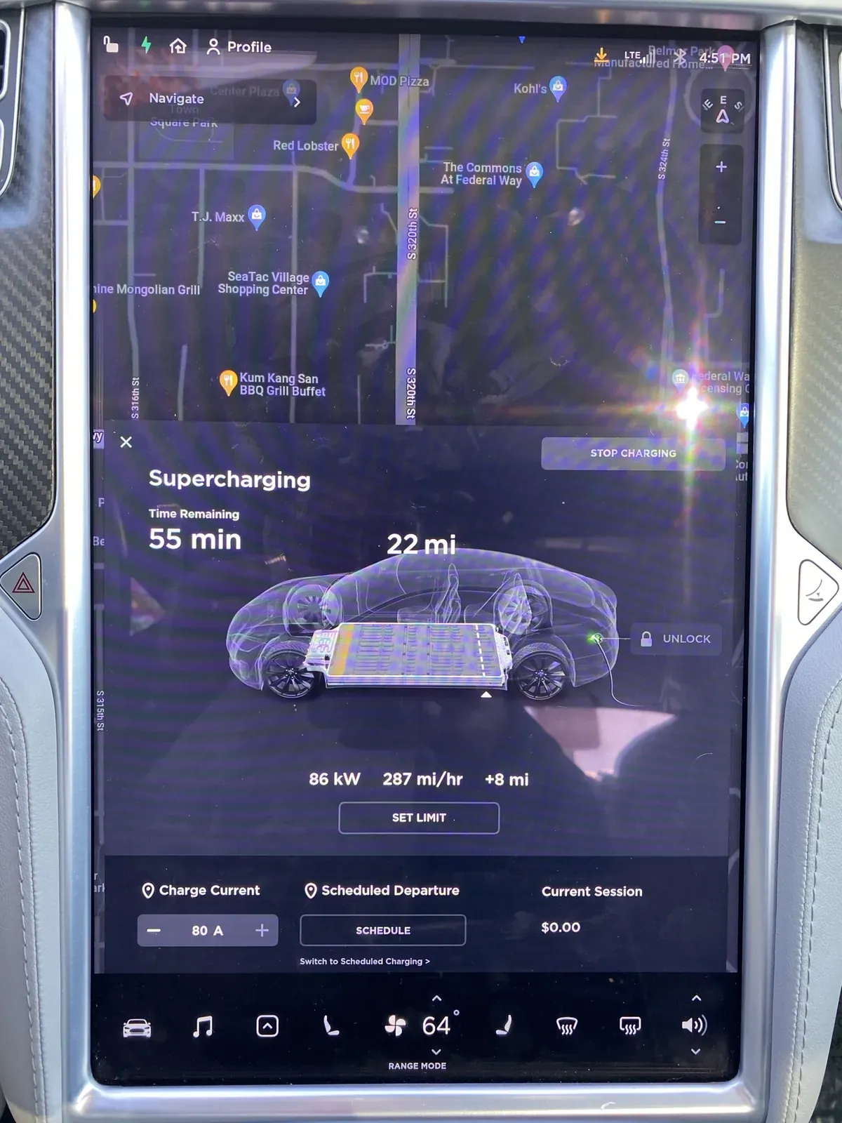Model S touchscreen showing Supercharging power, rate and time remaining