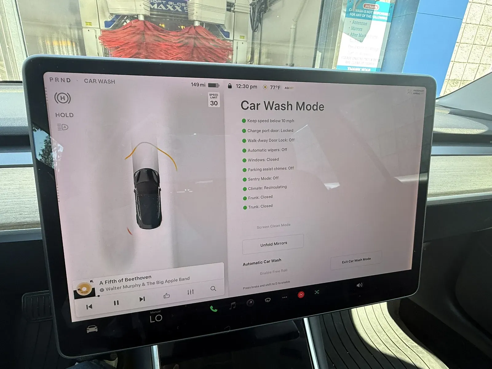 Model 3 touchscreen in Car Wash Mode at a car wash