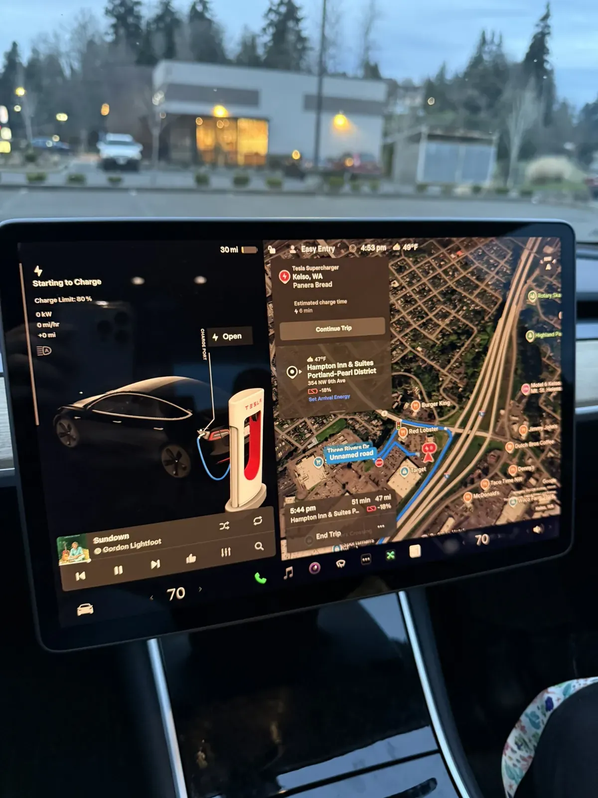 Model 3 screen showing Starting to Charge with the trip planner map